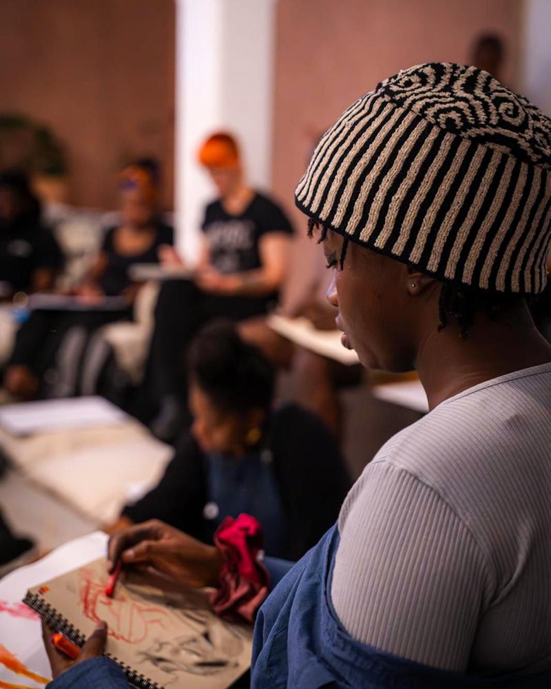 People sketching at a life drawing class